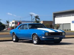  Blue 1968 Chevrolet Camaro with white racing stripes and chrome wheels