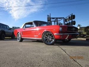  Red Ford Mustang convertible with chrome wheels