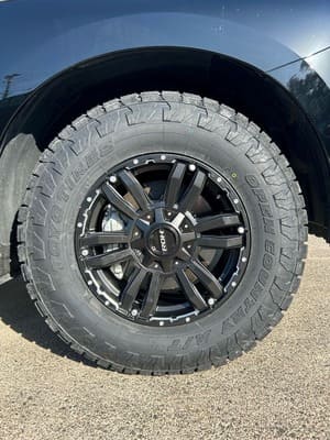  Close-up of black ROH wheel fitted with Toyo Open Country A/T tyre on Patrol.