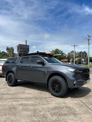  Grey Mazda BT-50 dual cab with black ROH wheels and Falken Wildpeak AT tyres, canopy and roof rack.