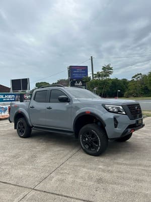  Grey Nissan Navara PRO-4X dual cab with upgraded suspension and wheels.