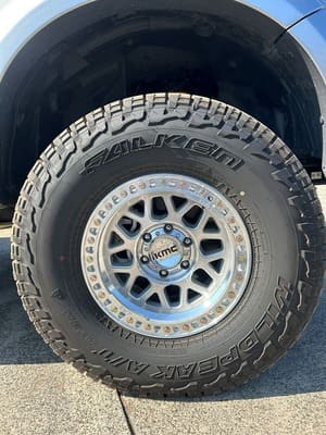  Close-up of silver KMC alloy wheel with Falken Wildpeak AT3W tyre on Next Gen Ranger.
