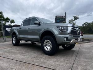  Silver GWM Cannon ute lifted with polished alloy wheels and mud-terrain tyres.