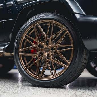  Close-up of a Mercedes G63 fitted with 23-inch Vossen HF7 Satin Bronze wheels and Pirelli Scorpion MS tyres.