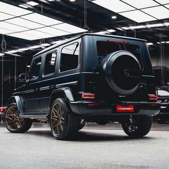  Rear view of a Mercedes G63 fitted with 23-inch Vossen HF7 Satin Bronze alloy wheels and Pirelli Scorpion MS tyres.